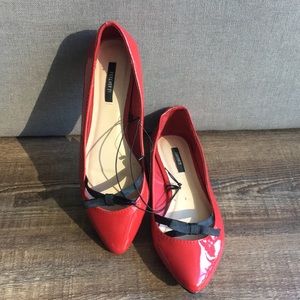 Patent red flats with cute black bow